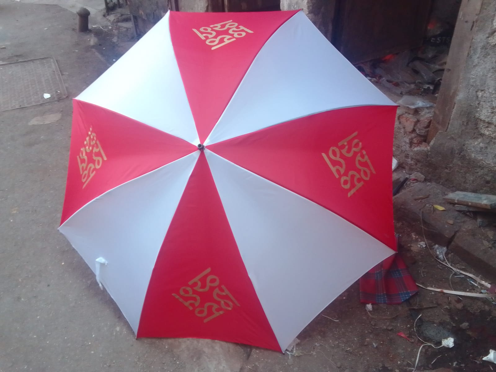 Red and white branded umbrella